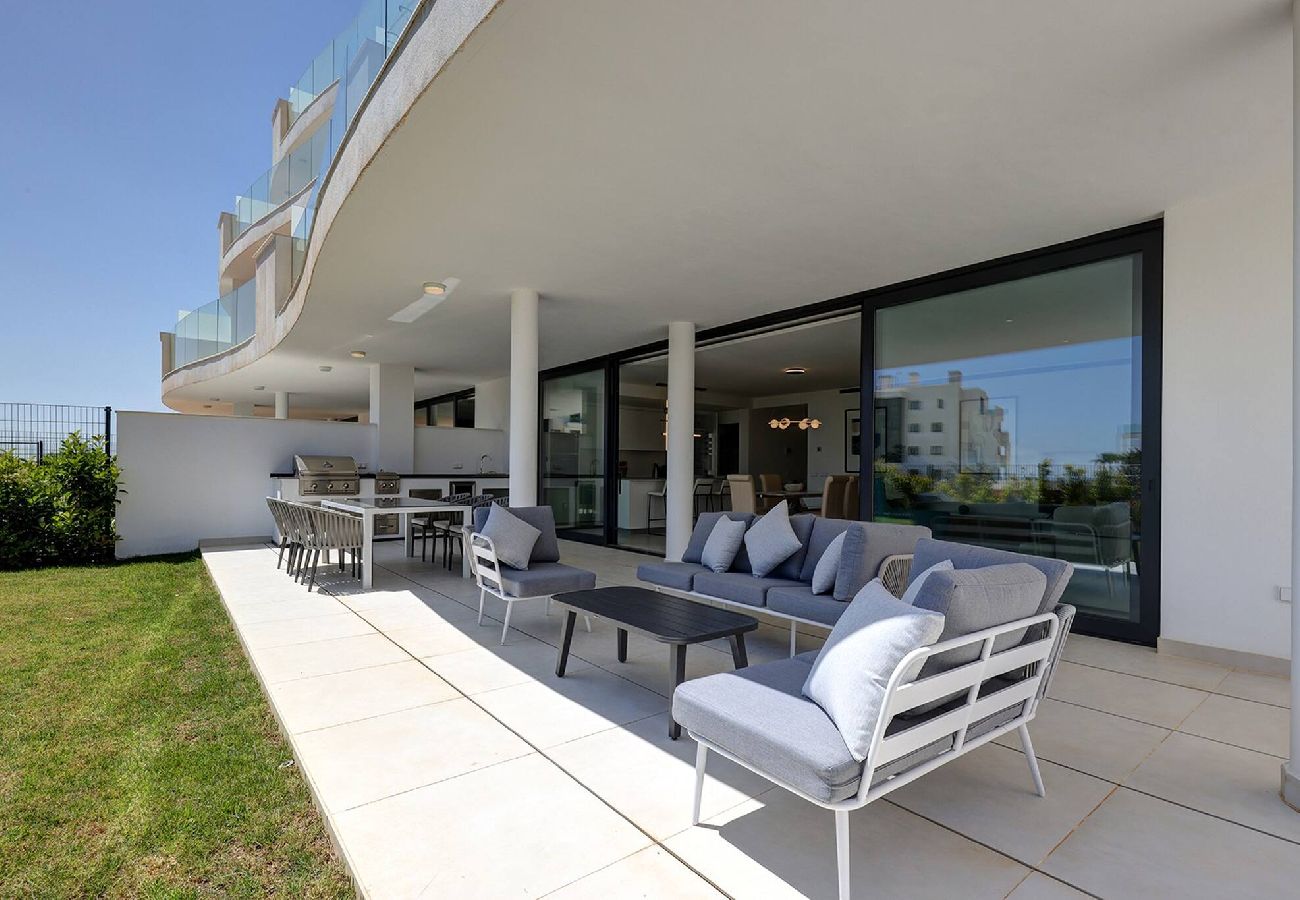 Apartment in Fuengirola - Modern El Higueron West Apt with Private Garden & BBQ