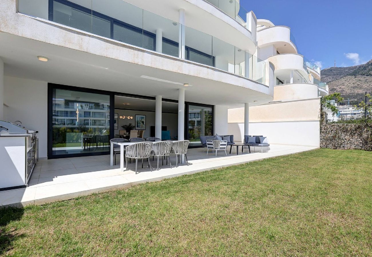 Apartment in Fuengirola - Modern El Higueron West Apt with Private Garden & BBQ