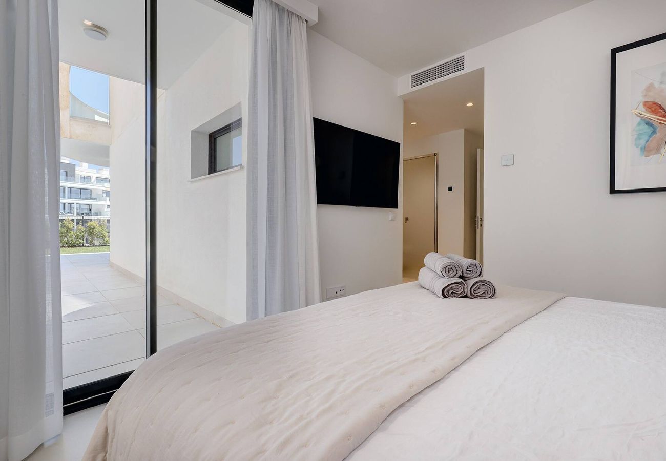 Apartment in Fuengirola - Modern El Higueron West Apt with Private Garden & BBQ