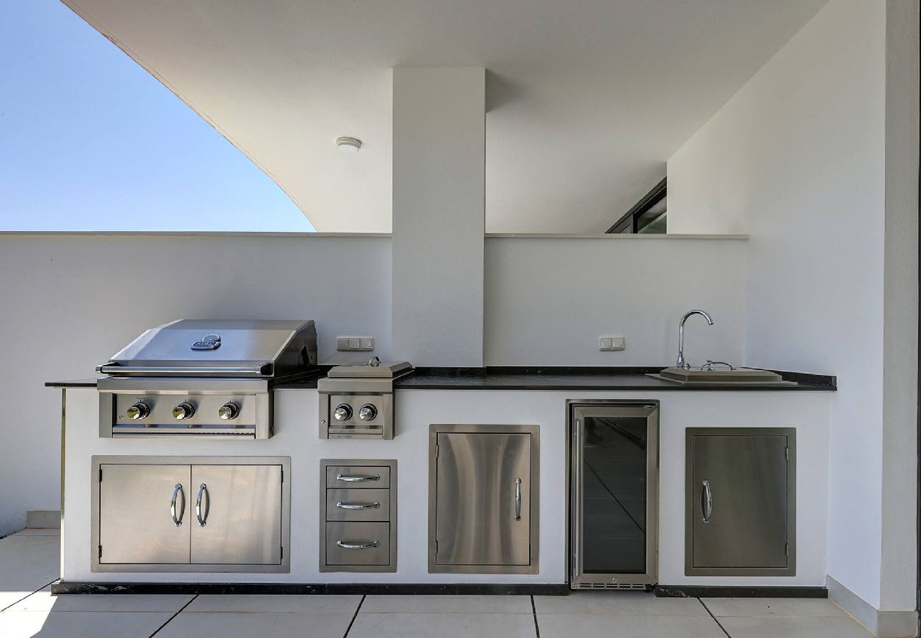 Apartment in Fuengirola - Modern El Higueron West Apt with Private Garden & BBQ