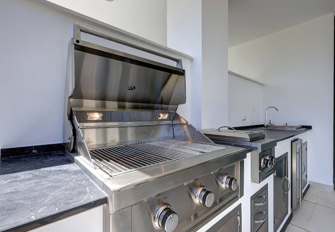 Apartment in Fuengirola - Modern El Higueron West Apt with Private Garden & BBQ