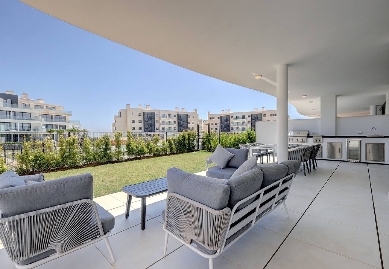 Apartment in Fuengirola - Modern El Higueron West Apt with Private Garden & BBQ